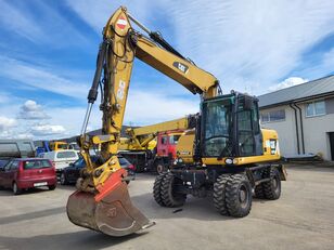 Caterpillar M313D 4X4 hjulgraver